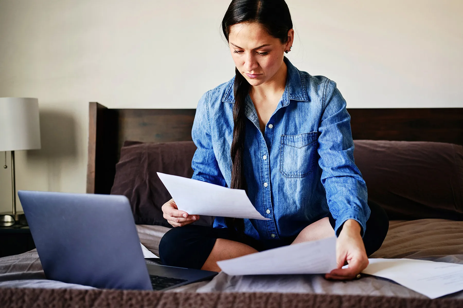 photo of woman looking at medical bills