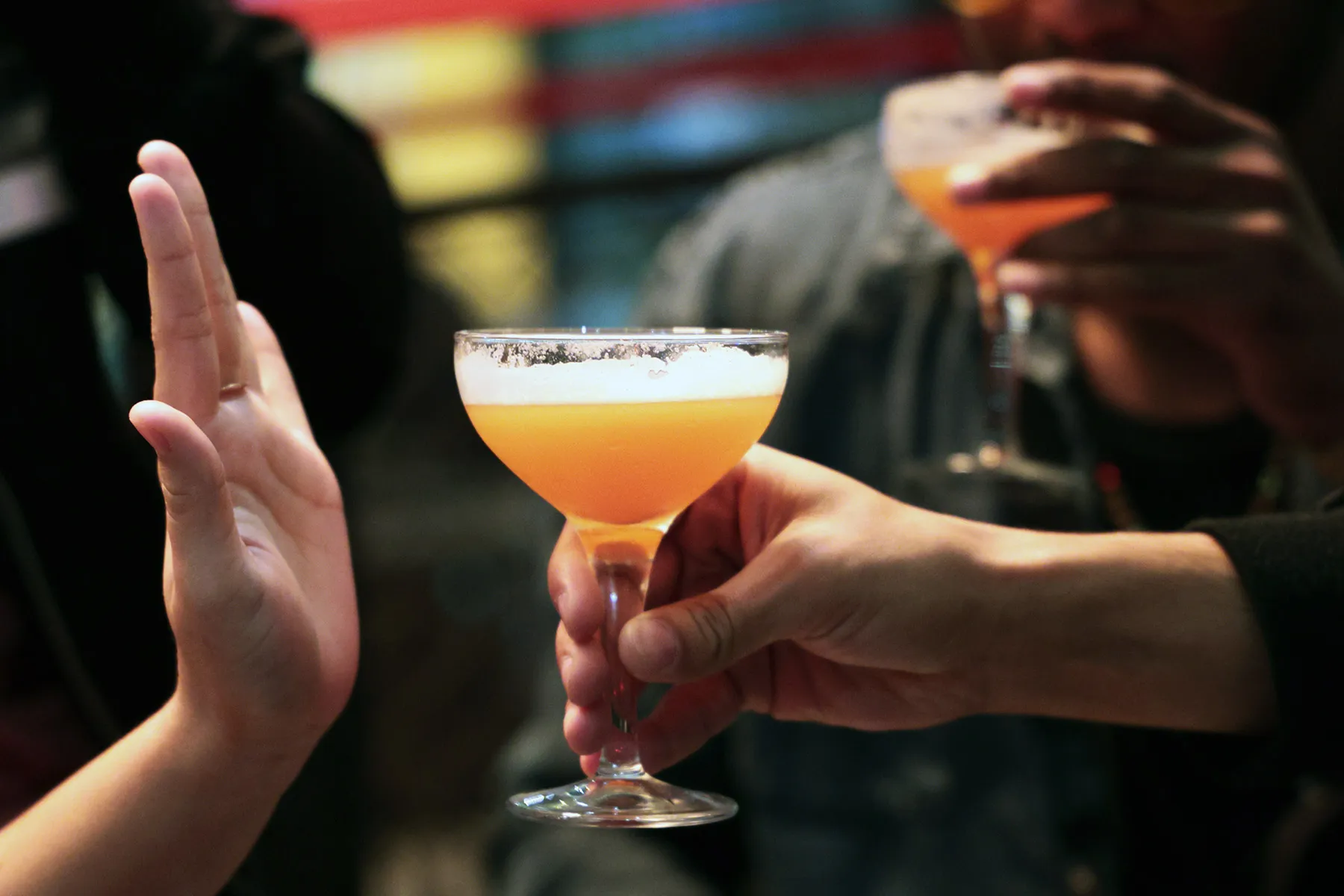 photo of woman refusing alcoholic drink